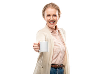 happy middle aged woman showing coffee cup with copy space Isolated On White