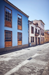 Fototapeta na wymiar Street in San Cristobal de La Laguna (known as La Laguna), its historical center was declared a World Heritage Site by UNESCO in 1999, color toned picture, Tenerife, Spain.