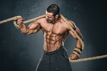 Strong Muscular Men Trapped in Ropes Trying to brake lose. Bodybuilder Trapped in Ropes