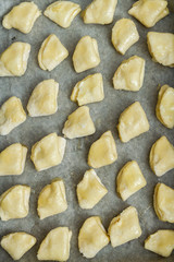 Cottage cheese cookies are on a baking sheet before cooking in the oven