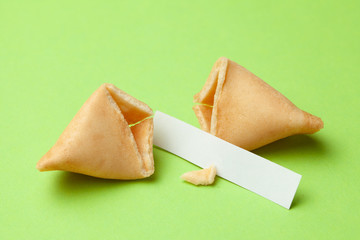 Chinese fortune cookies. Cookies with empty blank inside for prediction words. Green background.