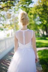 Fototapeta na wymiar blonde hair bride in garden