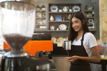 Coffee maker with staff being used. Employees working with coffee makers.