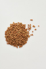 pile of flax seeds isolated on white background