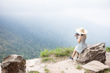 Fototapeta na wymiar Cute girl is traveling on high mountain. Khao Yai national park, Thailand.