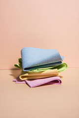 Pile of dish cloths in different colors. Abstract conception with powder studio background. Collection 2.