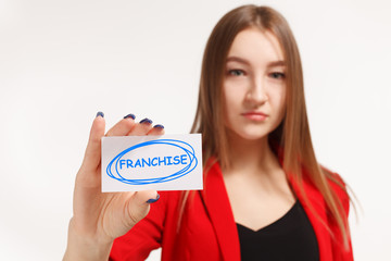 Business, technology, internet and networking concept. Young entrepreneur showing keyword: Franchise