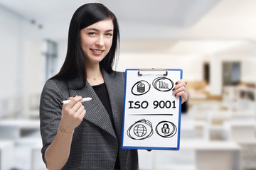 Business, technology, internet and networking concept. Young entrepreneur showing keyword: ISO 9001