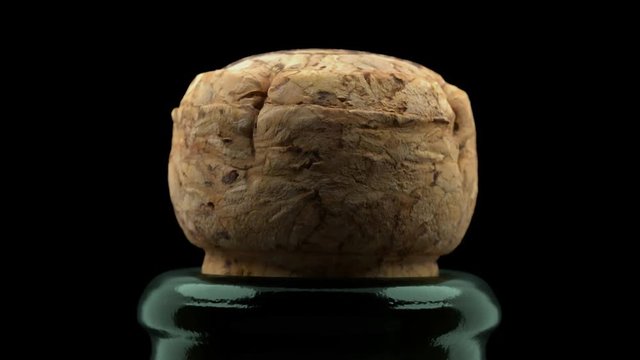 Cork flies out of champagne bottle isolated on black background 3d 4K