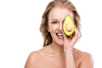 happy nude middle aged woman posing with avocado Isolated On White