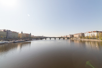Fototapeta premium Charles Bridge in a daylight. Sailing on a river