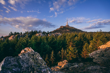 View of a sunrise or sunset landscape of Jizerske mountains and the top of Jested mountain. Rocks,...