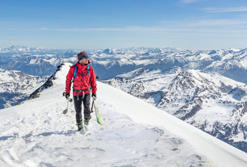 Male touring skier in the mountains