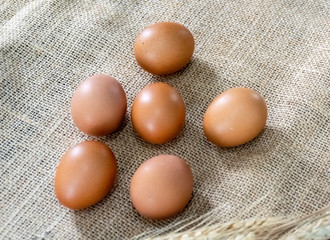 Fresh eggs on sackcloth in the farm