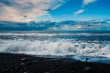 blue sea and cloudy sky waves