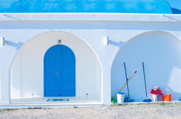 Ayia Thekla Chapel with blue arched doors and columns