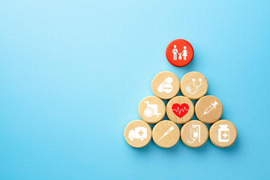 Health Insurance Concept, Wooden Blocks With Healthcare Medical Icon, Blue Background, Copy Space