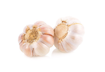whole unpeeled bulb garlic on white background