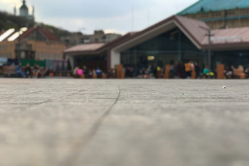 Obraz premium Abstract cityscape. Selective focus on a plot of city square. With blurred buildings in the background. City background with place for text.