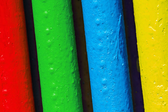 Pipes painted in colors of famous software manufacturer logo. Corporation logo concept. Red, green, blue, yellow tubes colors