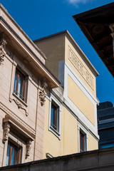 Fototapeta na wymiar Milan, Italy, 03/28/2018: skyline of the city with the historic sign of Corriere della Sera, the most important Italian daily newspaper, founded in 1876, seen from via Solferino (Solferino Street) 