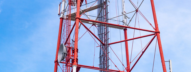 4G TV radio tower with parabolic antenna and satellite dish. Broadcast network signal. High...