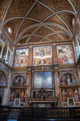 Fototapeta premium Italy, 03/28/2019: San Maurizio al Monastero Maggiore, 1518 church known as the Sistine Chapel of Milan, details of altarpiece and dividing wall in the faithful's area with frescoes by Aurelio Luini