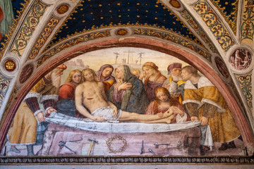 Italy, 28/03/2019: San Maurizio al Monastero Maggiore, a 1518 church known as the Sistine Chapel of Milan, view of the fresco Deposition from the Cross by Bernardino Luini in the Hall of the nuns