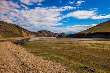 Pink rhyolite mountains surround the valley.