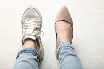  legs in sports shoe and beautiful elegant classic shoes