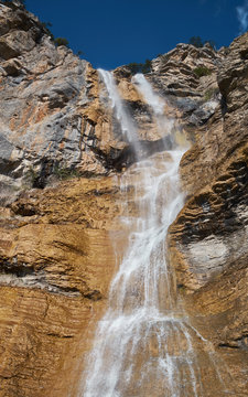Beautiful waterfall with cloudy sky landscape. Uchan su waterfall in Yalta, Crimea, Russia.