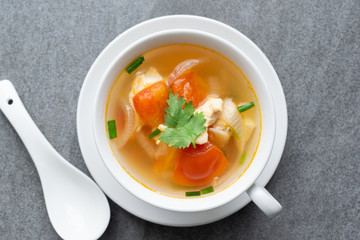 Hot soup chicken healthy at morning on concrete table.