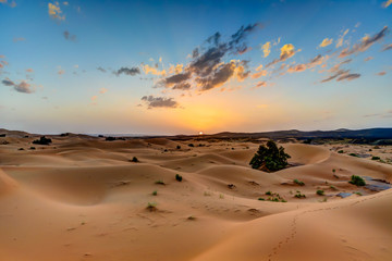 Fototapeta na wymiar Sunset in the Sahara Desert in Morocco