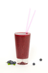 Glass of fresh cool blueberry sorbet from fresh blueberries on white background