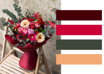 The layout is in color - a lesson in color in floristics. Working in a flower shop - a beautiful bouquet in red colors © Tamara