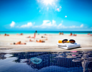 Fototapeta na wymiar Swimming pool background and summer beach 