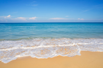 Fototapeta na wymiar Beach sand and blue sea in blue sky
