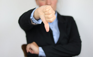 businesswoman with thumb down