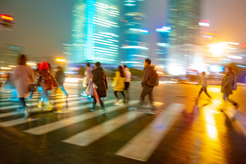 Abstract background of People across the crosswalk at night in Shanghai, China. - 268166996