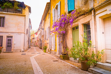 Fototapeta na wymiar View of a narrow street in the historical center of Arles