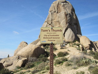 View of Tom's Thumb with an information sign in the Sonoran McDowell Mountain range 
