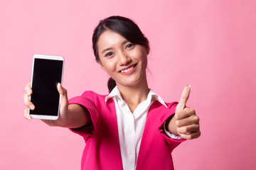 Young Asian woman show thumb up  with mobile phone.