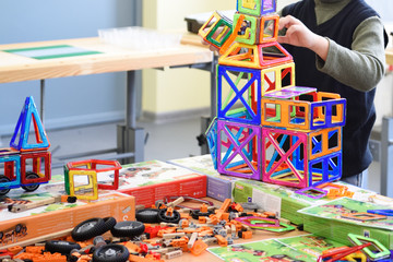 Children play with the innovative modern constructor for development in the fab lab at school