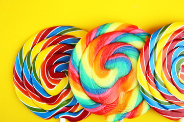 Fototapeta na wymiar lolly candies with sugar. colorful array of childs lollipops sweets and treats with candy