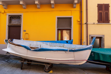 Fototapeta na wymiar Cinqueterre, Italy . 04-19-2019. Little fishing boat at manarola villageone of five villages of Cinqueterre. Liguria. Italy.