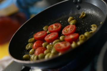 Making dinner at restaurant. Proffesional cooker