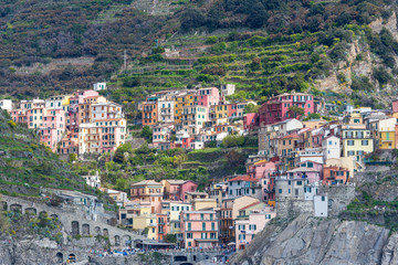 Fototapeta na wymiar Cinqueterre, Italy . 04-19-2019. View of Riomaggiore village one of five villages of Cinqueterre. Liguria. Italy. 