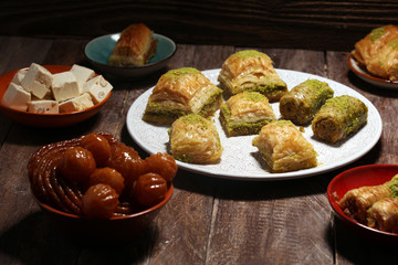Middle eastern or arabic dishes. Turkish Dessert Baklava with pistachio on dishes