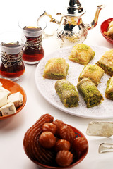Middle eastern or arabic dishes. Turkish Dessert Baklava with pistachio on dishes