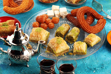 Middle eastern or arabic dishes. Turkish Dessert Baklava with pistachio on dishes